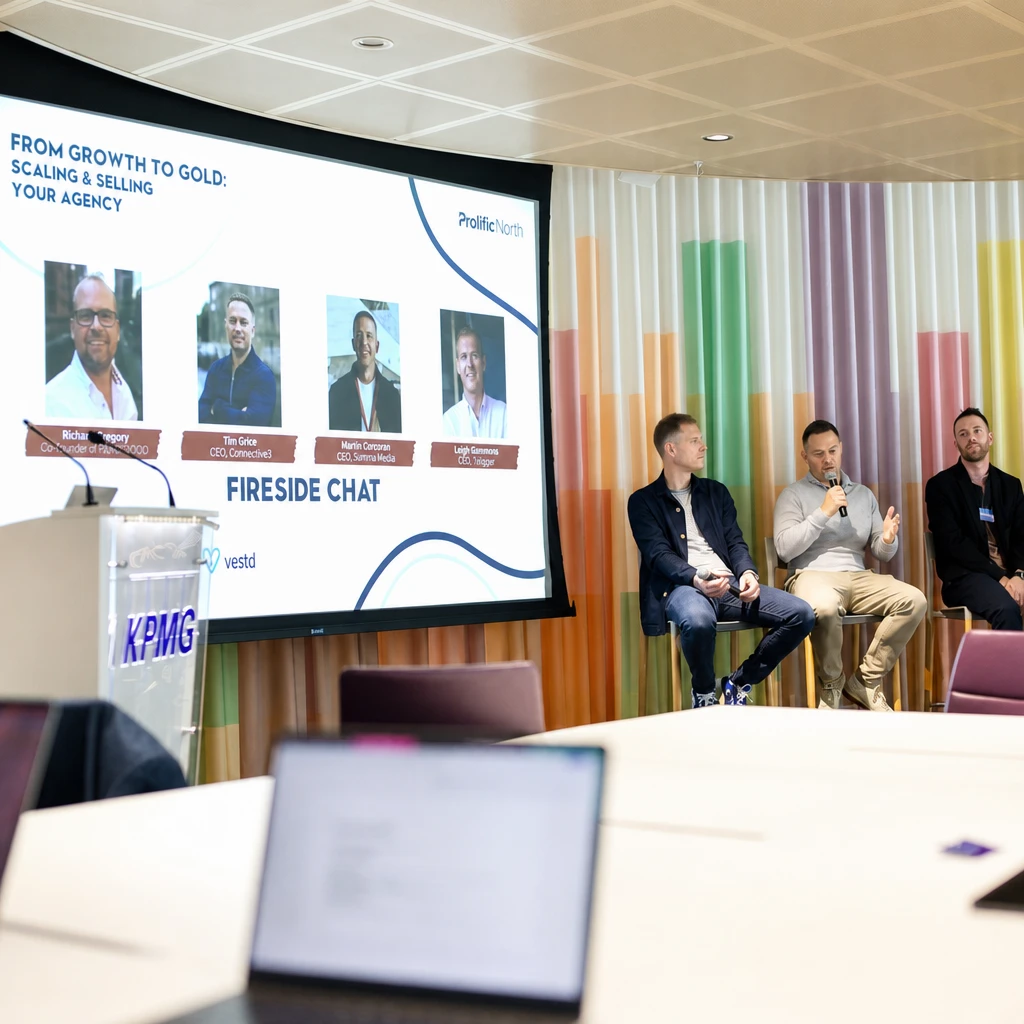 Fireside chat on stage at Growth to Gold Leeds 2026, hosted at KPMG